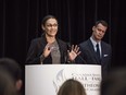 Inductee to Canada's Sports Hall of Fame Susan Auch, Speed Skating, speaks at a press conference as Hall of Fame Inductee and presenter Mark Tewksbury looks on, in Toronto, Wednesday, Oct. 21, 2015. A spokesman says the Speed Skating Canada board of directors decided Thursday that it "was in the best interest" of the federation that Auch no longer serve in the role.