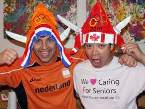 In 2010, Jan Paul Snip (left) and Ken Sim show off the funny hats they wore to Olympic events.