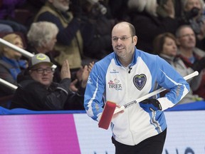 Jean-Michel Menard helped Canada win gold at the World Mixed Curling Championship in Scotland on Saturday.