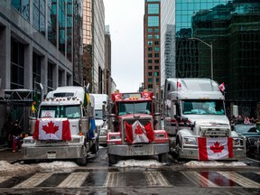 Trucks block a street in Ottawa on Feb. 6.