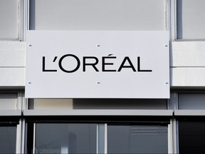 This photo taken on Feb. 16, 2018 shows a board with the L'Oreal logo outside of the L'Oreal plant, in Lassigny.