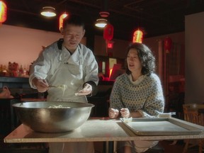 Jackie Kai Ellis and Joe Zhou of Hong Kong House Chinese Restaurant in Grand Prairie Alberta make cream cheese wontons together during an episode of the docuseries House Special.