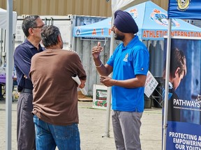 Harpreet Jhinjar, right, the APD’s gang prevention coordinator.