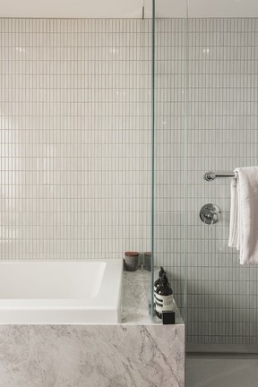 Tiles have an unusual glaze that breaks over the edge, defining backsplashes on walls in the bathrooms.