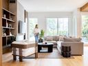 In the living room, built-in shelves house the family's precious objects, flanking a concrete-overlay fireplace surround. 