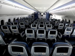 IN FLIGHT  - MAY 11: Many of the seats aboard a United Airlines flight sit empty on May 11, 2020 in flight to Houston, Texas from San Francisco. Air travel is down as estimated 94 percent due to the coronavirus (COVID-19) pandemic, causing U.S. airlines to take a major financial hit with losses of $350 million to $400 million a day and nearly half of major carriers airplanes are sitting idle. (Photo by Justin Sullivan/Getty Images) ORG XMIT: 775511639
