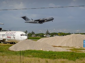 A Canadian military plane takes off from Toussaint Louverture International Airport in Port-au-Prince, Haiti on October 15, 2022. The flight had been delivering security aid to combat the rising takeover of critical infrastructure by heavily armed gangs.