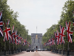 British flags line The Mall in front of Buckingham Palace.