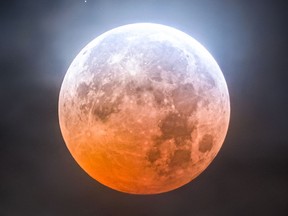 Photographer Liron Gertsman captured images of the "beaver blood moon" lunar eclipse in the partly cloudy skies over Vancouver on Tuesday, Nov. 8, 2022.