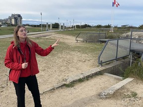 Canadian student guide Sidney Cadaggis of Langley outside the German bunker at Juno Beach.