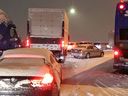 On Tuesday, November 29, 2022, dozens of vehicles were stuck in the northbound lane of the Alex Fraser Bridge for several hours as snow piled up. 