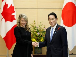 Foreign Minister Melanie Joly is greeted by Japanese Prime Minister Fumio Kishida in Tokyo during a visit last month to discuss how Canadian LNG could wean Asian nations off their dependence on Russian natural gas.