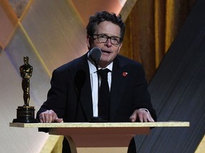 Honoree Canadian-American actor Michael J. Fox accepts the Jean Hersholt Humanitarian Award during the Academy of Motion Picture Arts and Sciences' 13th Annual Governors Awards at the Fairmont Century Plaza in Los Angeles on Nov. 19, 2022.