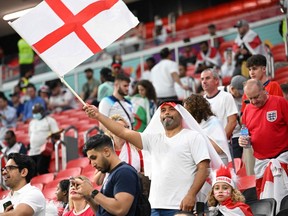 England supporters cheer ahead of the Qatar 2022 World Cup Group B football match between England and USA at the Al-Bayt Stadium in Al Khor, north of Doha on Nov. 25, 2022.