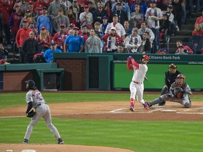 Philadelphia Phillies designated hitter Bryce Harper (3) hits a two run home run off of Houston Astros starting pitcher Lance McCullers Jr. (43) during the first inning in game three of the 2022 World Series at Citizens Bank Park.