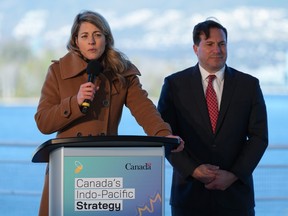 Minister of Foreign Affairs Melanie Joly responds to questions as Minister of Public Safety Marco Mendocino listens during a news conference to announce Canada's Indo-Pacific strategy in Vancouver on Sunday, Nov. 27, 2022.