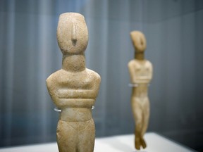 Marble Cycladic female figurines are displayed during the opening of the exhibition ''Homecoming. Cycladic treasures on their return journey'' at Museum of Cycladic Art, in Athens Greece, November 2, 2022. REUTERS/Costas Baltas