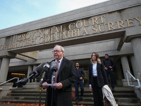 Former Surrey mayor Doug McCallum reads a brief statement outside provincial court after being found not guilty of public mischief, in Surrey, B.C., on Monday, November 21, 2022.