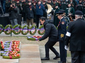 Vancouver Mayor Ken Sim lays a wreath at the Cenotaph during the Remembrance Day ceremony on Friday.