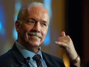 Premier John Horgan, on his last day in office, addresses the B.C. Chamber of Commerce at the Pan Pacific Hotel in Vancouver on Thursday, November 17, 2022.