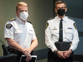 Assistant Commissioner Brian Edwards (left) commands the Surrey RCMP detachment.  Chief Norm Lipinski, right, commands the new Surrey Police Service.