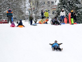 Children enjoy a snow day at Kensington Park on Jan. 15, 2020.