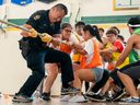 Vancouver police’s school liaison program in action in May 2018, when then-Vancouver police school liaison officer Const. Alan Man helped out his team in a tug-of-war tournament at Vancouver Technical Secondary School.
