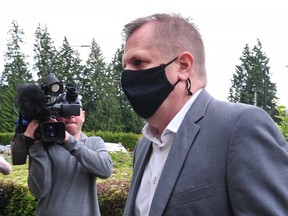 Former Whitecaps women’s coach Bob Birarda arrives at North Vancouver courthouse for a sentencing hearing earlier this year.