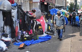 Scenes from the Downtown Eastside (DTES) as the City complied with the Vancouver Fire Department's order to clear tents from the sidewalks for health and safety reasons in Vancouver, BC., on August 9, 2022.