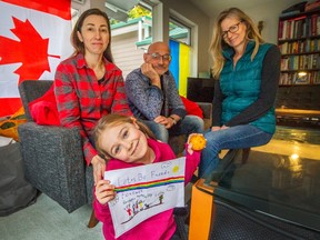 Olga Afanasieva and her eight year old daughter Milana are guests of Randall Schultz and Sally Howard (far right) in South Surrey.