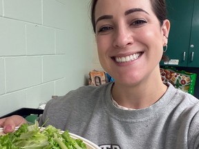 Teacher Ashley Munro with a meal for one of her hungry students.