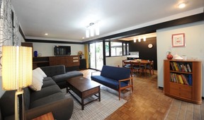 The family room/den retains an original 1960 stereo console at one end.