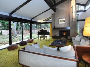 The living room from a house designed by Ron Thom in 1960. Note the shag carpet, floor to ceiling windows, and unique angled ceiling.