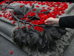 A poppy is placed on the Tomb of The Unknown Soldier following a Remembrance Day ceremony at the National War Memorial in Ottawa on Monday Nov. 11, 2019.