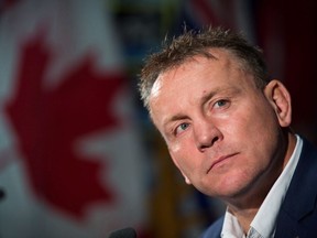 Rugby Canada men's national team Head Coach Kingsley Jones listens after he was introduced as the new coach of the team, in Vancouver on October 24, 2017. Jones has named a 36-man long list ahead of selection for test matches in Europe later this month against the Netherlands and Namibia.