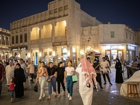 People walk at Souq Waqif, a traditional marketplace, ahead of the FIFA World Cup 2022 soccer tournament, in Doha, Qatar November 7, 2022. REUTERS/Marko Djurica