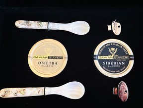 Caviar with mother of pearl spoons, tin opener.