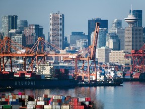 Containers sit stacked at the DP World and Global Container Terminals Inc. in Vancouver Harbour.