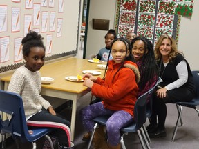 Bear Creek Elementary principal Diane Bradley and some of her students who are having breakfast that is supported by Vancouver Sun readers.