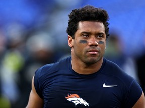 Quarterback Russell Wilson of the Denver Broncos runs off the field following the Broncos 10-9 loss to the Baltimore Ravens at M&T Bank Stadium on Sunday in Baltimore, Maryland.