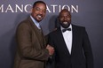 Will Smith, left, and director Antoine Fuqua pose for photographers upon arrival for the premiere of the film 'Emancipation' in London, Friday, Dec. 2, 2022.