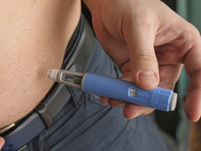 A man injecting Semaglutide Ozempic.
