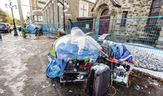 Snow covers tents and belongings on the sidewalk of 900 block of Pandora Avenue. People who are homeless are being affected by the outbreak, Island Health says. 
