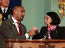 Housing and government house leader Ravi Kahlon fists pumps Lt.-Gov. Janet Austin during the swearing-in ceremony at Government House in Victoria on Dec. 7, 2022.
