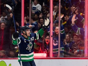 Bo Horvat (53) celebrates his goal against the Sharks in the first period at Rogers Arena.