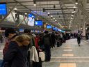 There were long lineups at YVR on Tuesday morning as many flights were delayed or cancelled due to the snowstorm that hit the area overnight.