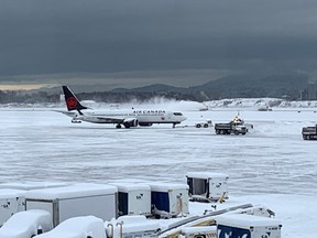 Scene from YVR on Dec. 20, 2022, after an overnight winter storm blanketed the region with snow.
