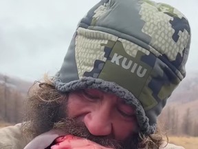 In this still photo, Brian Johnson, known as Liver King, eats the raw liver of a Mongolian yak.