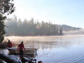 Parks Canada staff work on Cheewaht Lake on Nov. 16, 2022.