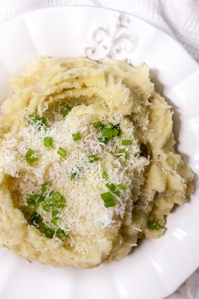 Just before serving, garnish these Cheesy garlic Herb Potatoes with freshly grated parmesan cheese and additional chives. Karen Gordon photo